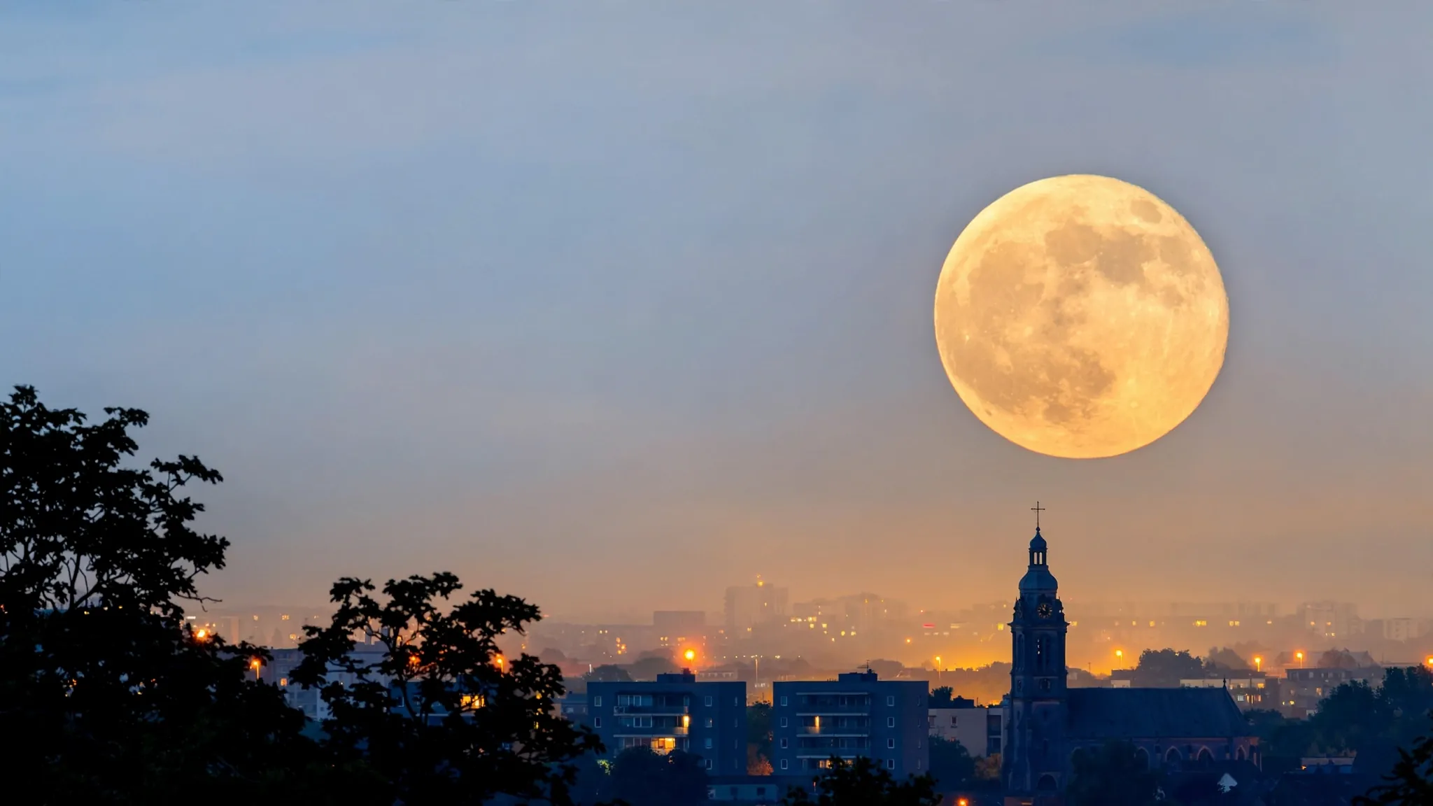 moonrise above a city horizon