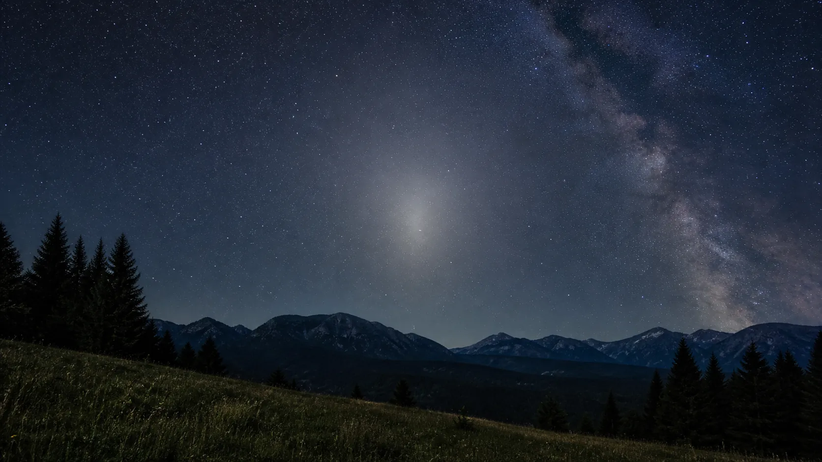 subtle gegenschein glow above a dark Slovak landscape